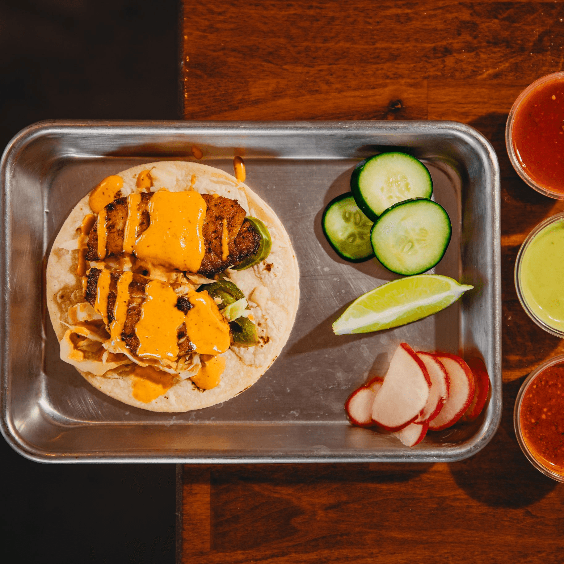 Baja Grilled Fish Taco taco — Cabbage slaw, chipotle crema, pickled onion